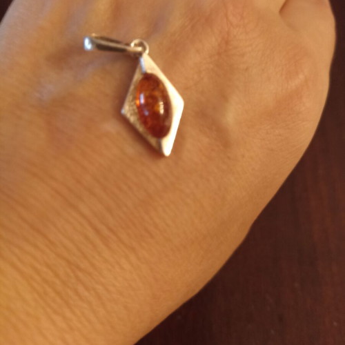 Silver pendant with amber new