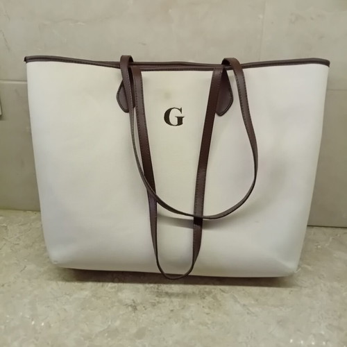 Large beige fabric shoulder bag with brown leather details
