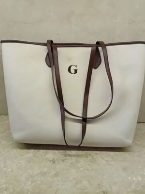 Large beige fabric shoulder bag with brown leather details