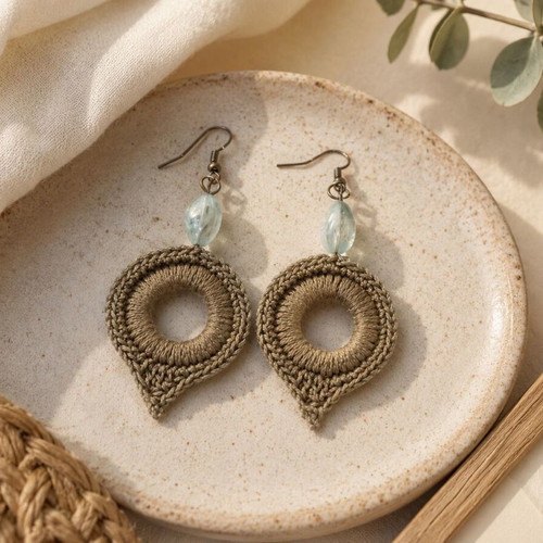 Handmade olive green earrings with blue bead