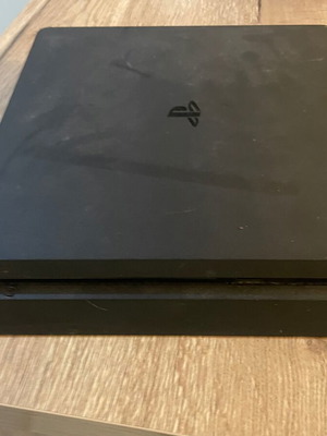 PlayStation 4 Slim 500GB like new with controller and 4 games