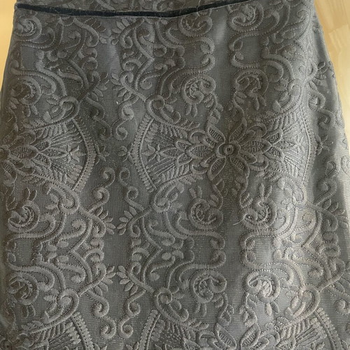 Zinas black mini pencil skirt made of embossed brocade fabric