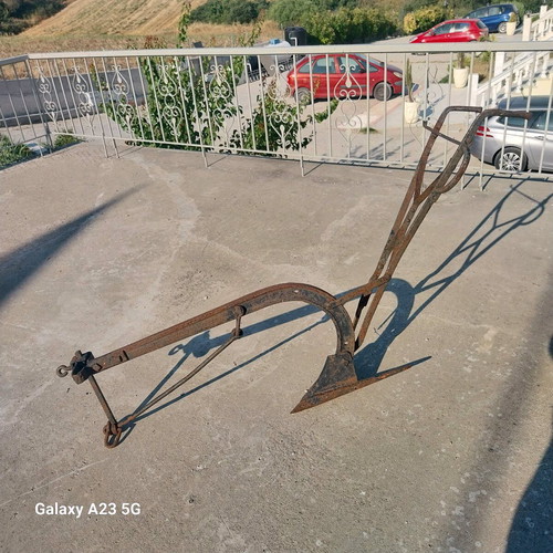 Plow used iron tool from 1940s for soil cultivation