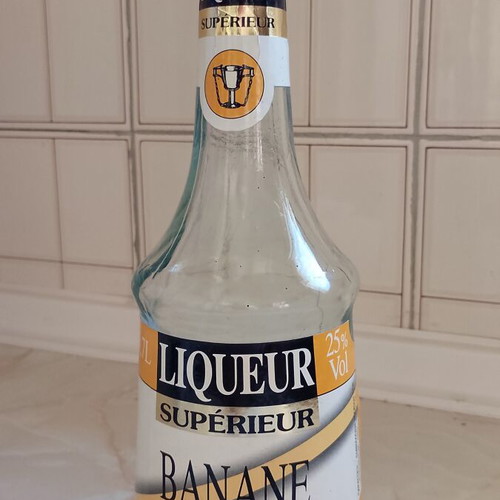 Vintage banana liqueur bottle used, empty for collection