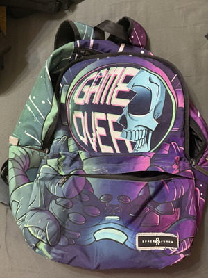 Space Junk Game Over backpack used with skull and game controller graphic