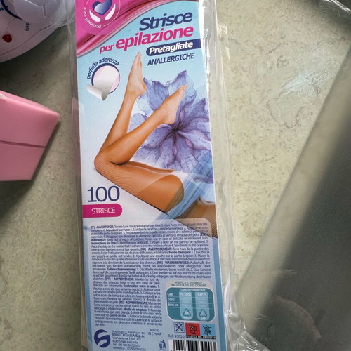 Pro-Wax 100 wax warmer used for hair removal with accessories