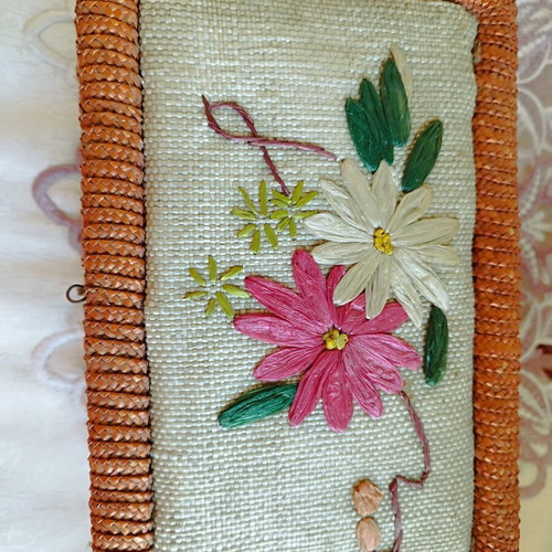 Vintage wicker sewing box with floral decoration used