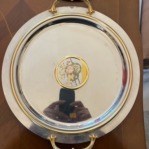 Serving dish made of steel with gold details like new