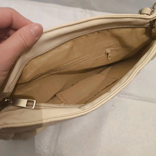 Women's shoulder bag like new, milky color with silver details