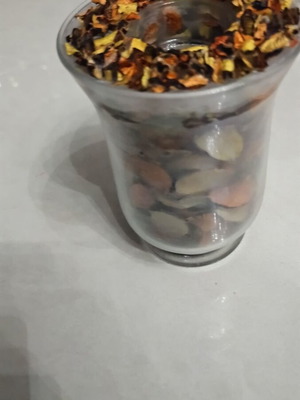 Handmade candle like new with aromatic potpourri in glass jar