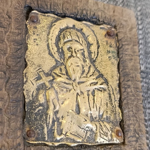 Saint Anthony brass icon on wood