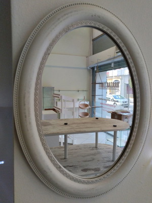 Oval mirror with beige wooden frame, vintage design
