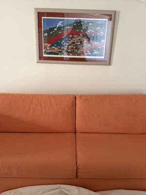 Sofa bed SATO used with two decorative pillows and throw