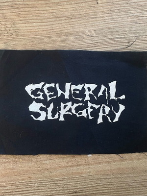 General Surgery patch new, black fabric with white print