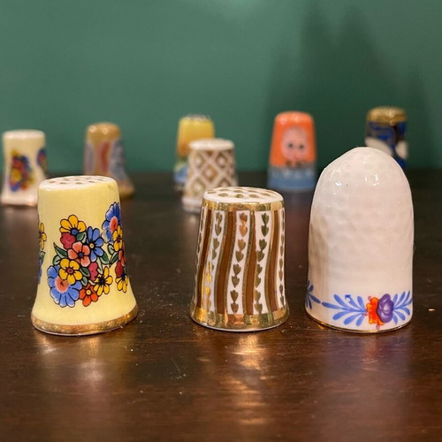 Set of 9 porcelain thimbles like new, collectible