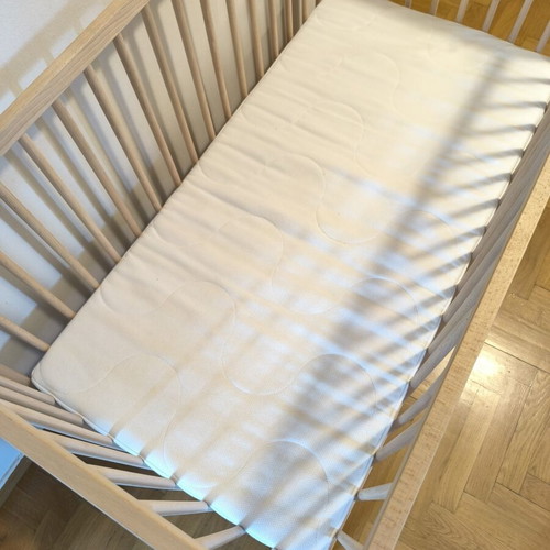 IKEA baby cot with mattress and bedding