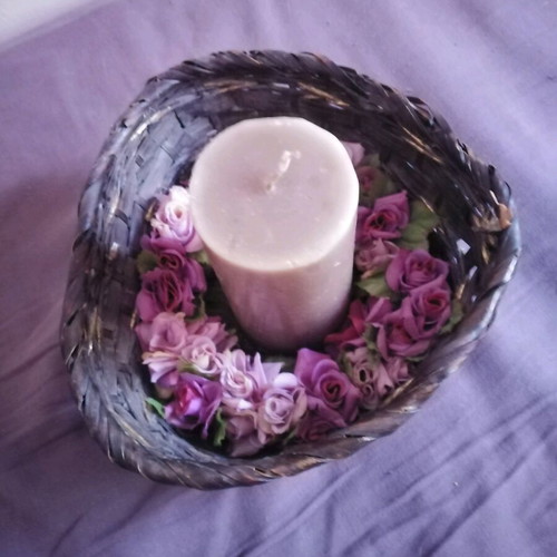 Decorative basket used with candle and floral wreath