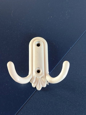 Small white metal hook like new