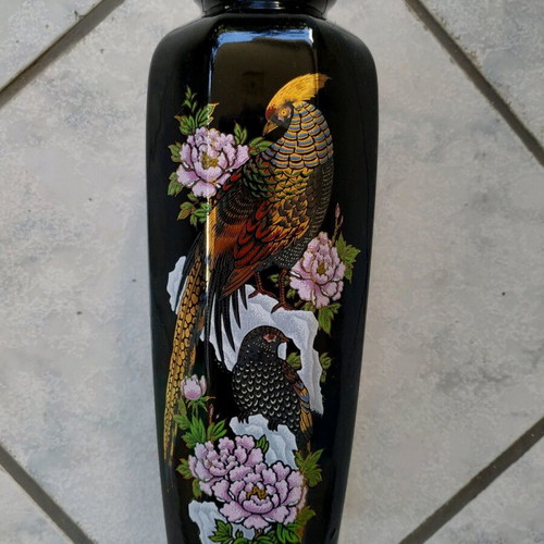 Black vase with golden embossed paintings