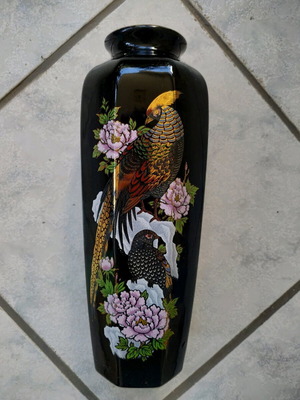 Black vase with golden embossed paintings