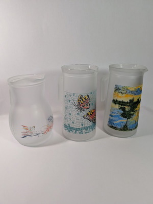Set of 3 used pitchers with designs, 20x9.5cm and 18.5x9cm