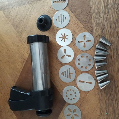 Biscuit press set used with 8 pastry nozzles and 10 dough designs