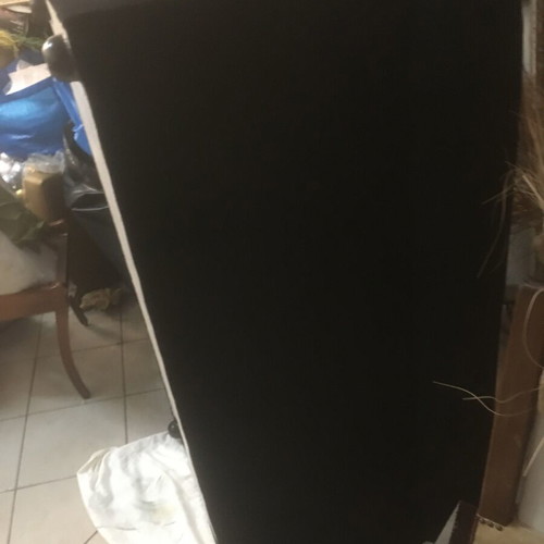 Two-seater black sofa used with wooden legs and washable fabric