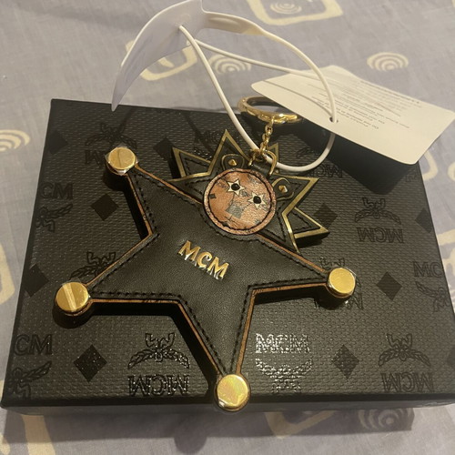 MCM Star Lion bag charm new, black and brown