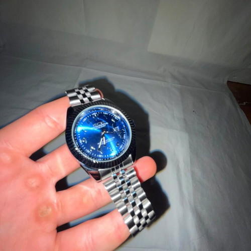 Seiko watch with blue dial and silver bracelet