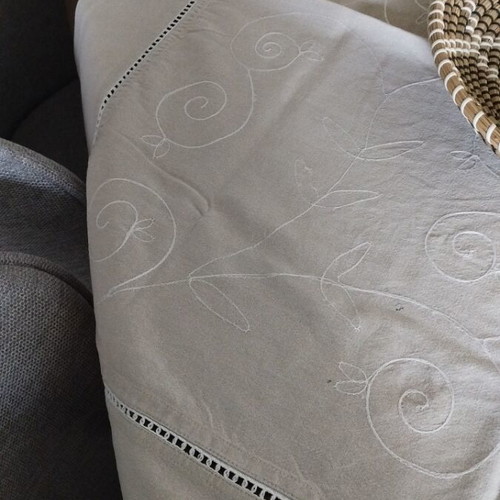 Linen tablecloth like new in earthy soft gray beige with embossed embroidery