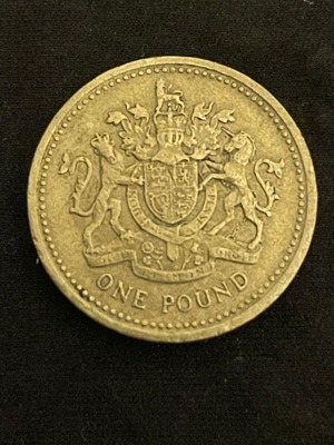British One Pound coin used with Royal Coat of Arms 1983