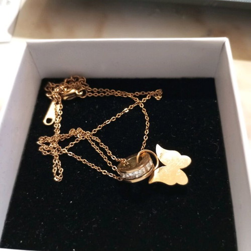 Steel necklace gold color with butterfly design and rhinestone ring