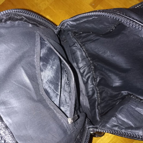 Backpack black leather type used with multiple pockets