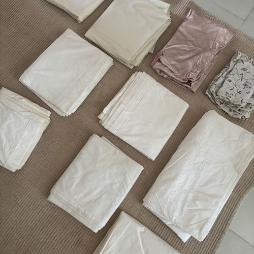 Set of embroidered cotton bed sheets, pillowcases and duvet covers