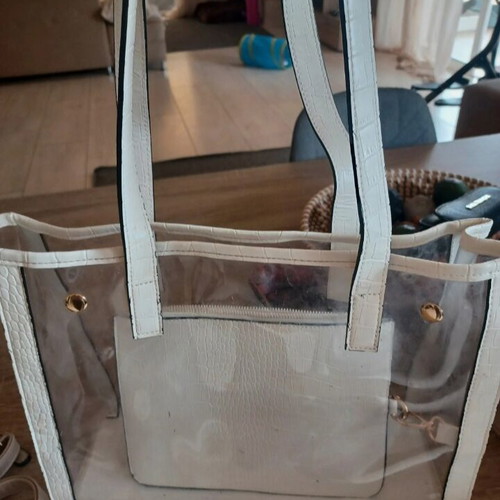 Transparent white bag used, shoulder and hand
