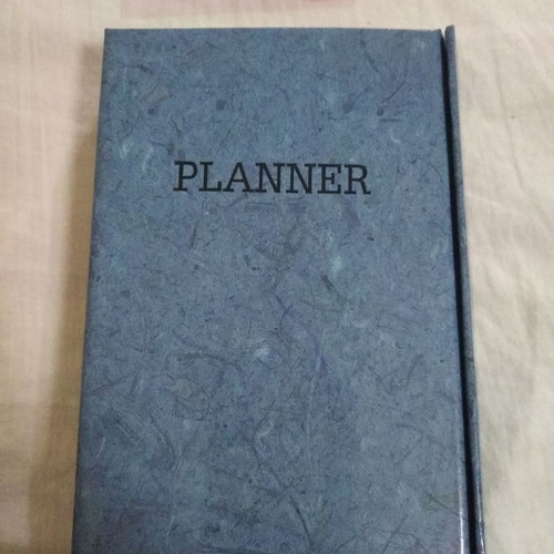 Phone book with magnetic closure and pen holder