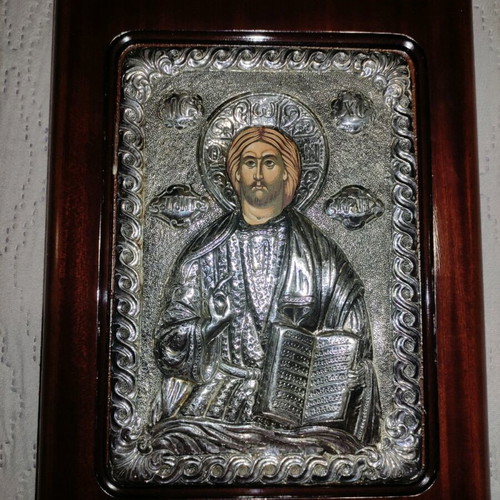 Silver icon of Christ with natural wood frame used
