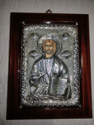 Silver icon of Christ with natural wood frame used