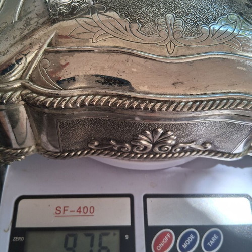 Vintage silver-plated jewelry box with floral design