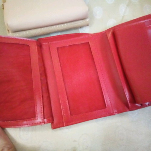 Women's wallet used, red with multiple compartments