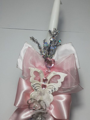 Handmade luxury candle with satin ribbon and decorative elements
