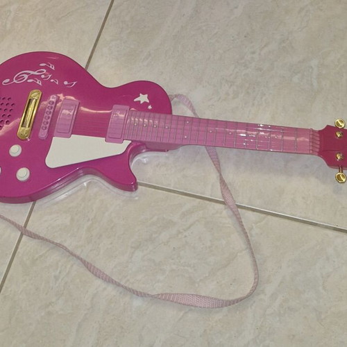 Children's guitar with sound like new