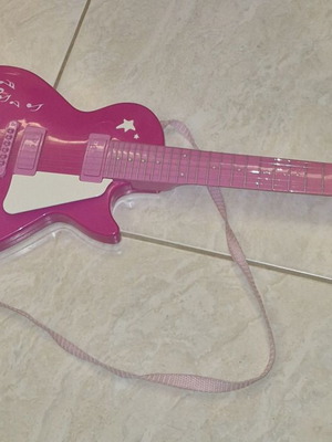 Children's guitar with sound like new