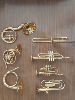 Set of miniature metal wind instruments like new