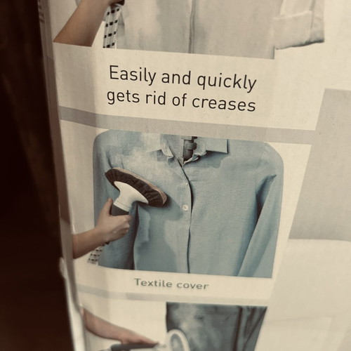 Vertical garment steamer with hanger and accessories