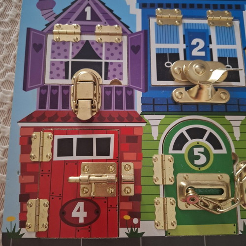 Melissa and Doug Activity Board like new, wooden with locks