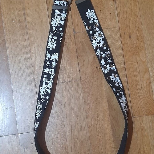 Belt like new, black with white floral pattern, size 110