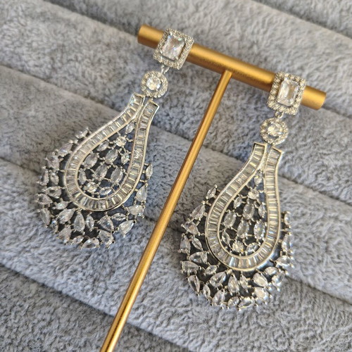 Long silver plated earrings with zircon stones