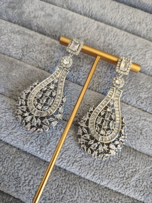 Long silver plated earrings with zircon stones