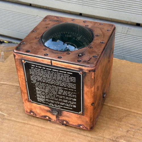 Old copper submarine compass used with artificial horizon